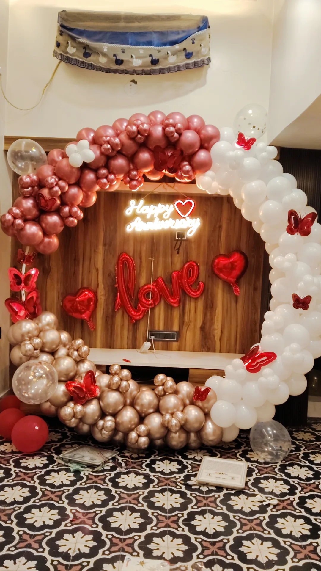 Rose gold and white anniversary balloon arch decoration