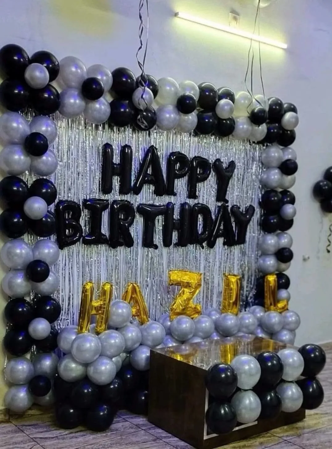 Black and silver birthday balloon arch for Hazil