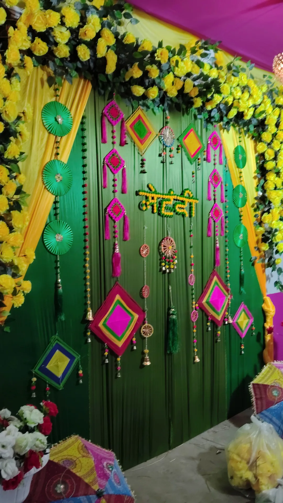 Green and pink hangings mehendi backdrop decoration