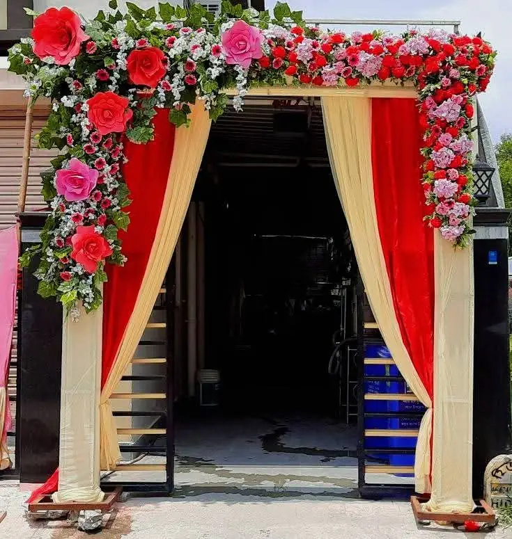 Red pink floral gate arch wedding decoration by New Patna Decorators